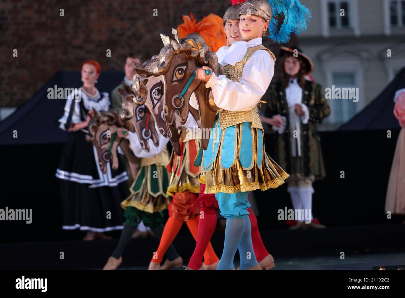 Krakow, Poland - July 25, 2021: Artists in costumes performing on stage during a show of court dances at the Main Market Square as part of the 22nd Cr Stock Photo