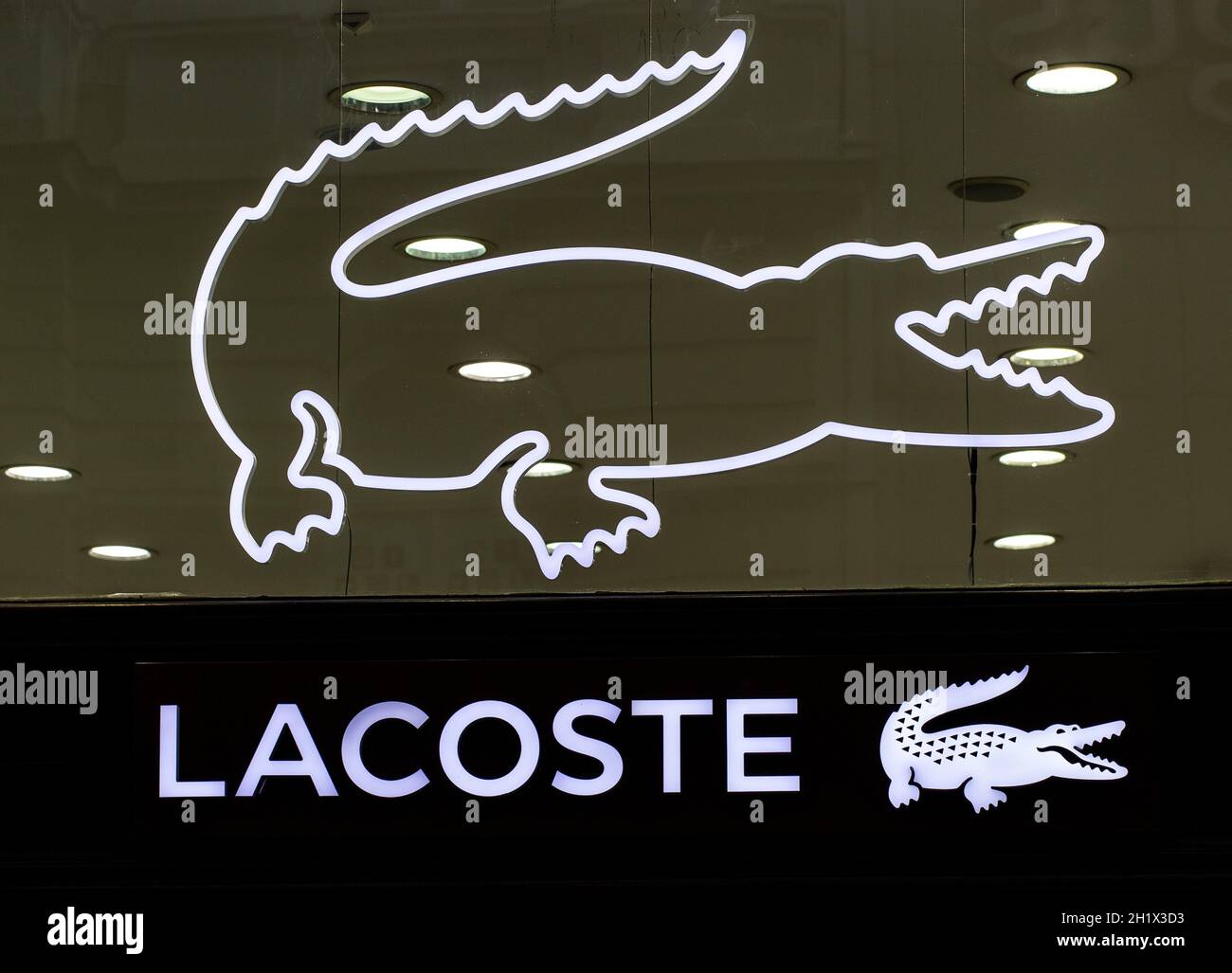 BELGRAD, SERBIA - JULE 16, 2021: Closeup of Lacoste sign on store front, Lacoste is the famous french chain of luxury polo Stock Photo