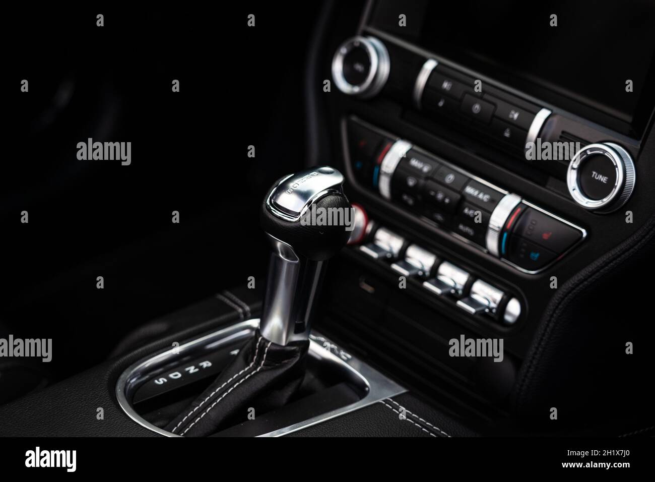 DIEDERSDORF, GERMANY - AUGUST 21, 2021: The details of interior of sports car Ford Mustang (sixth generation), close-up. Focus on the foreground. The Stock Photo
