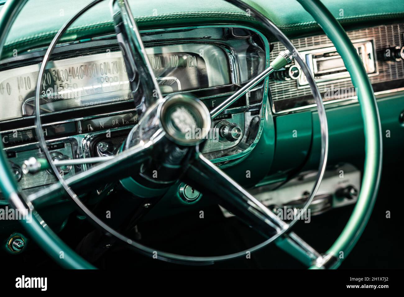 DIEDERSDORF, GERMANY - AUGUST 21, 2021: The dashboard of luxury car Cadillac Series 62 Coupe de Ville, 1953. Close-up. Focus on the background. The ex Stock Photo
