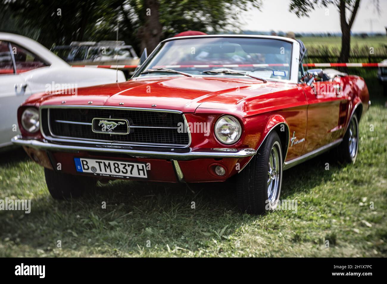 DIEDERSDORF, GERMANY - AUGUST 21, 2021: The iconic sports car Ford Mustang. Focus on center. Swirly bokeh. The exhibition of 'US Car Classics'. Stock Photo