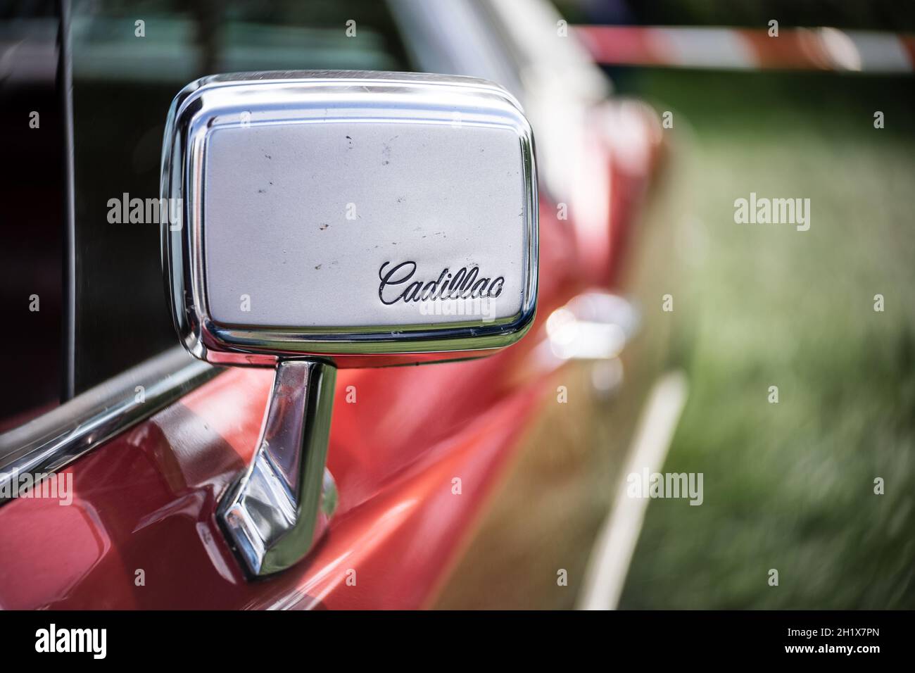 DIEDERSDORF, GERMANY - AUGUST 21, 2021: The rear view mirror of a full-size luxury car Cadillac de Ville. The exhibition of 'US Car Classics'. Stock Photo