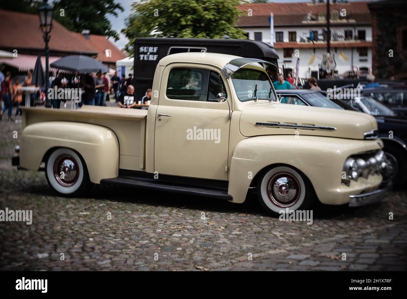 DIEDERSDORF, GERMANY - AUGUST 21, 2021: The full-size pickup truck Ford F-1, 1951. Focus on center. Swirly bokeh. The exhibition of 'US Car Classics'. Stock Photo