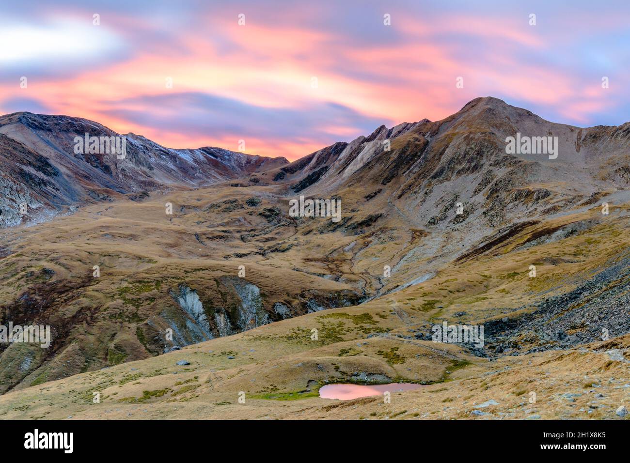 Beautiful mountain sunset with colors in the sky Stock Photo - Alamy