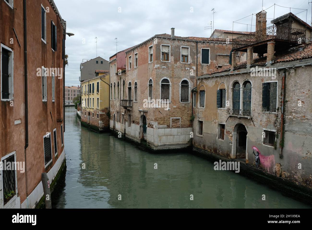 A new work of British street artist Banksy has been sighted in Venice on a building along the Rio de Ca Foscari canal in Venice, Italy May 15, 2019. Stock Photo