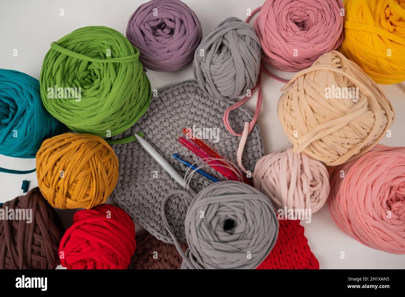 cotton yarn knitting pattern on white table Stock Photo Alamy