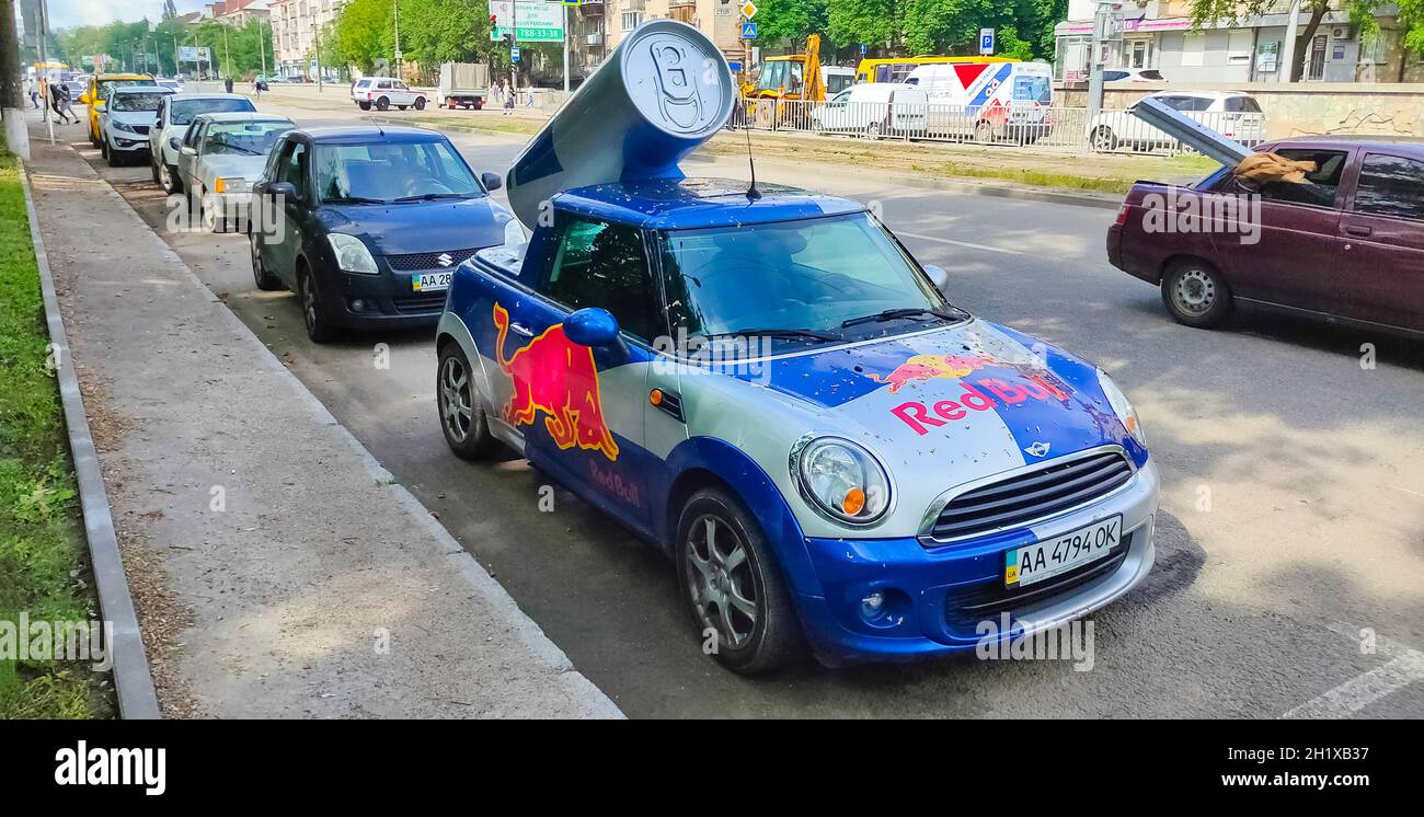 A blue / red / gray Red Bull print pattern Mini Cooper car, outside News  Photo - Getty Images