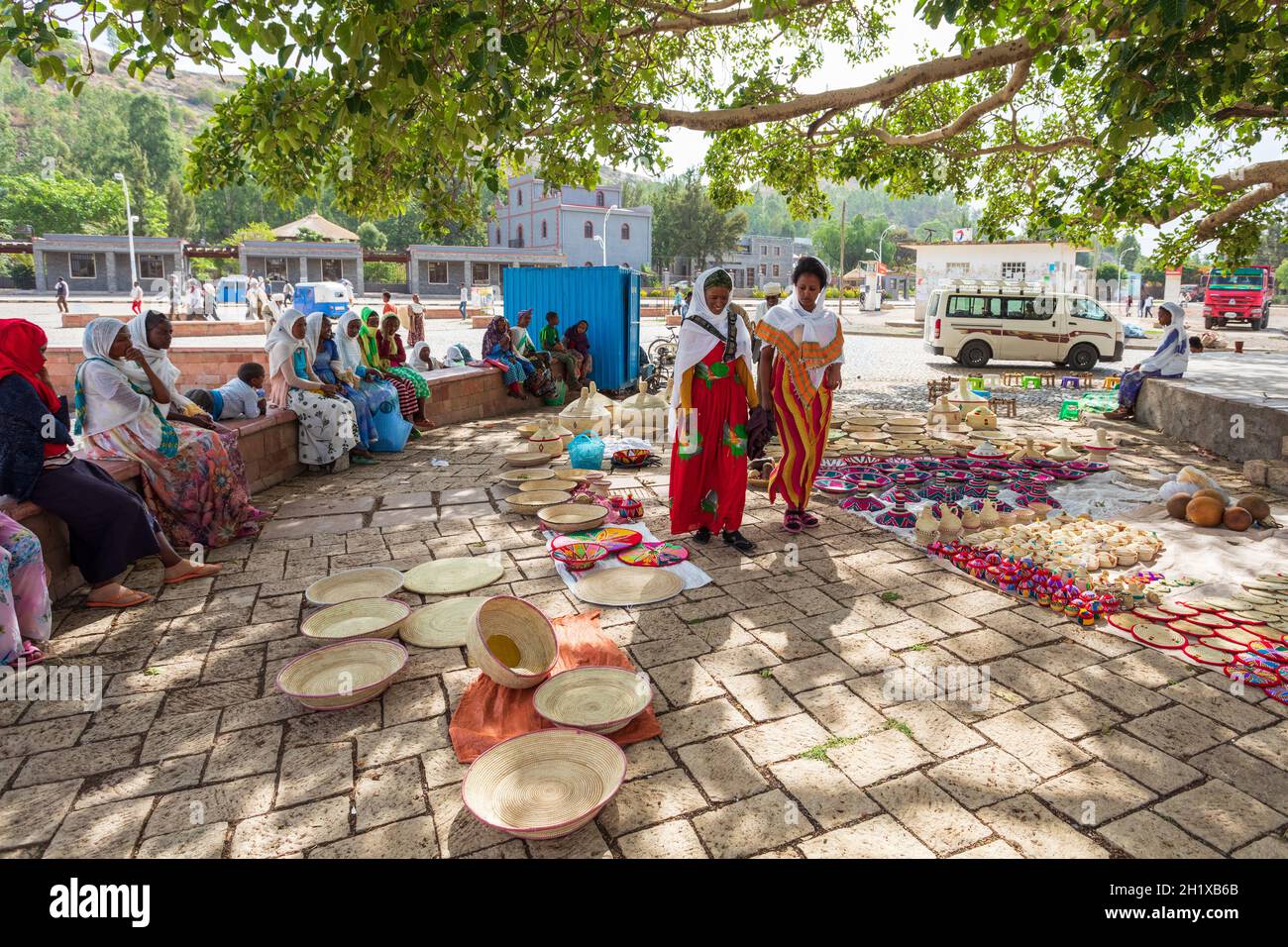 AXUM, ETHIOPIA, APRIL 27th.2019: Carefree tigray native woman resting in street market in center of Aksum on April 27, 2019 in Aksum, Tigray, Ethiopia Stock Photo