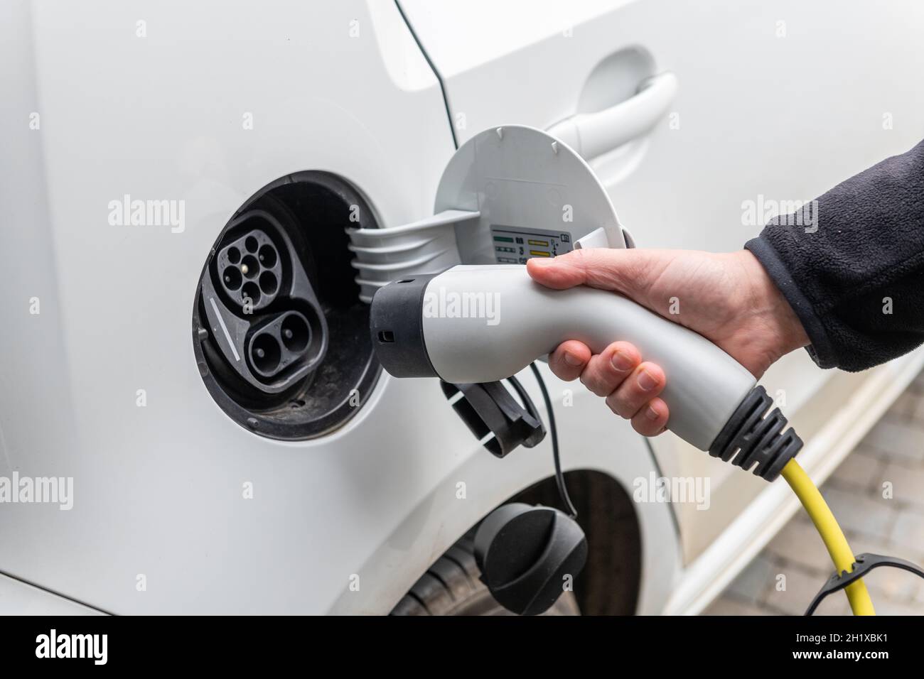 Electric car charging at home Stock Photo Alamy