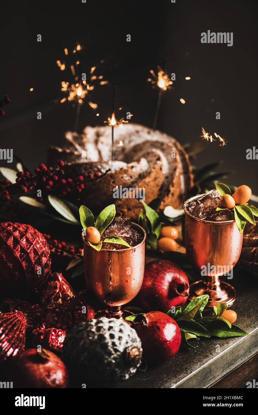 Christmas bundt cake and iced cocktails on kitchen counter Stock Photo