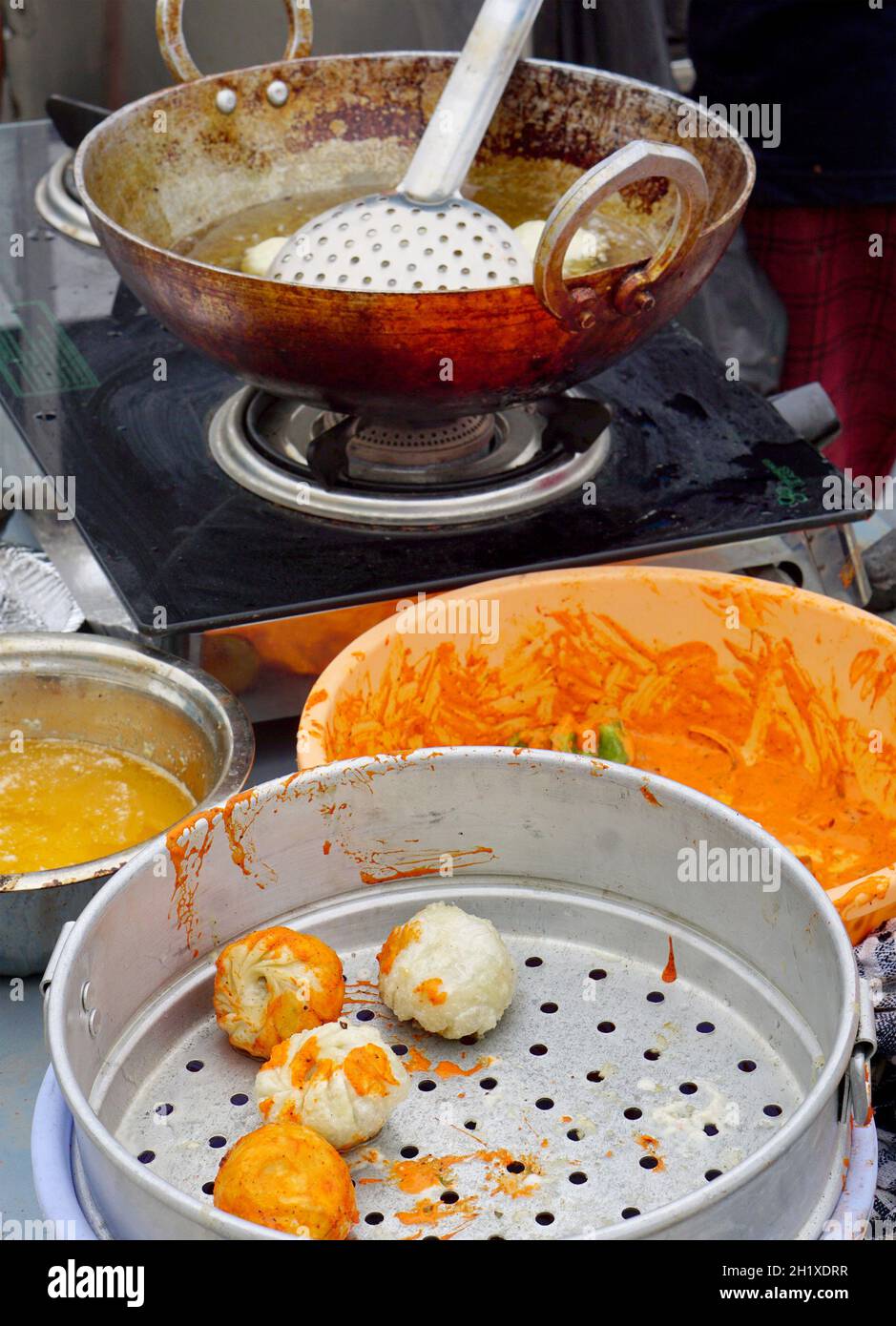Close-up view of Indian street vendor making snacks Stock Photo - Alamy