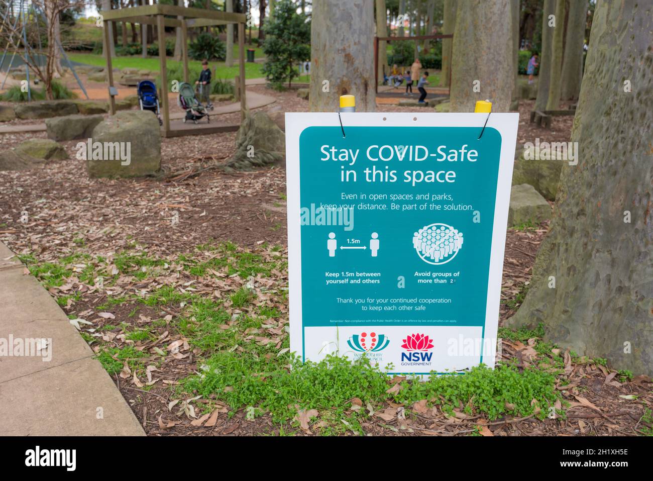 A sign in a Sydney park in the suburb of Roseville, warning people to stay Covid Safe by staying 1.5 metres apart Stock Photo