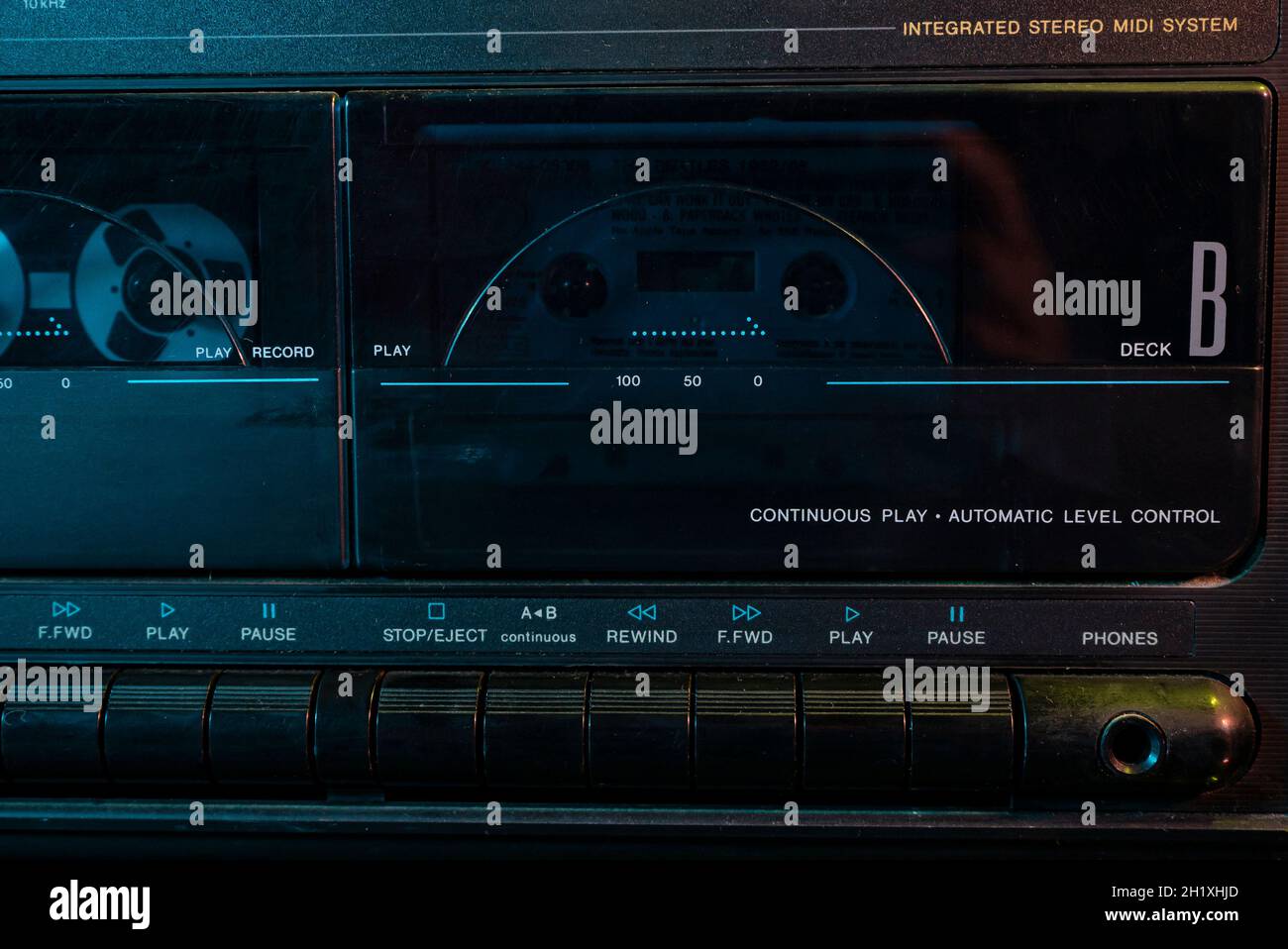 Music cassette play detail in a cassette player Stock Photo Alamy