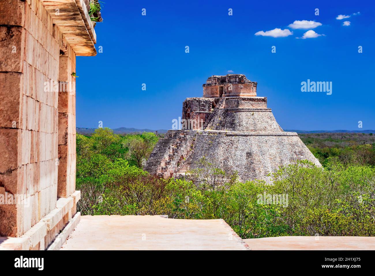 Uxmal, Mexico. Pyramid of the Magician in ancient jungle Mayan city Uxmal, Yucatan Peninsula. Stock Photo