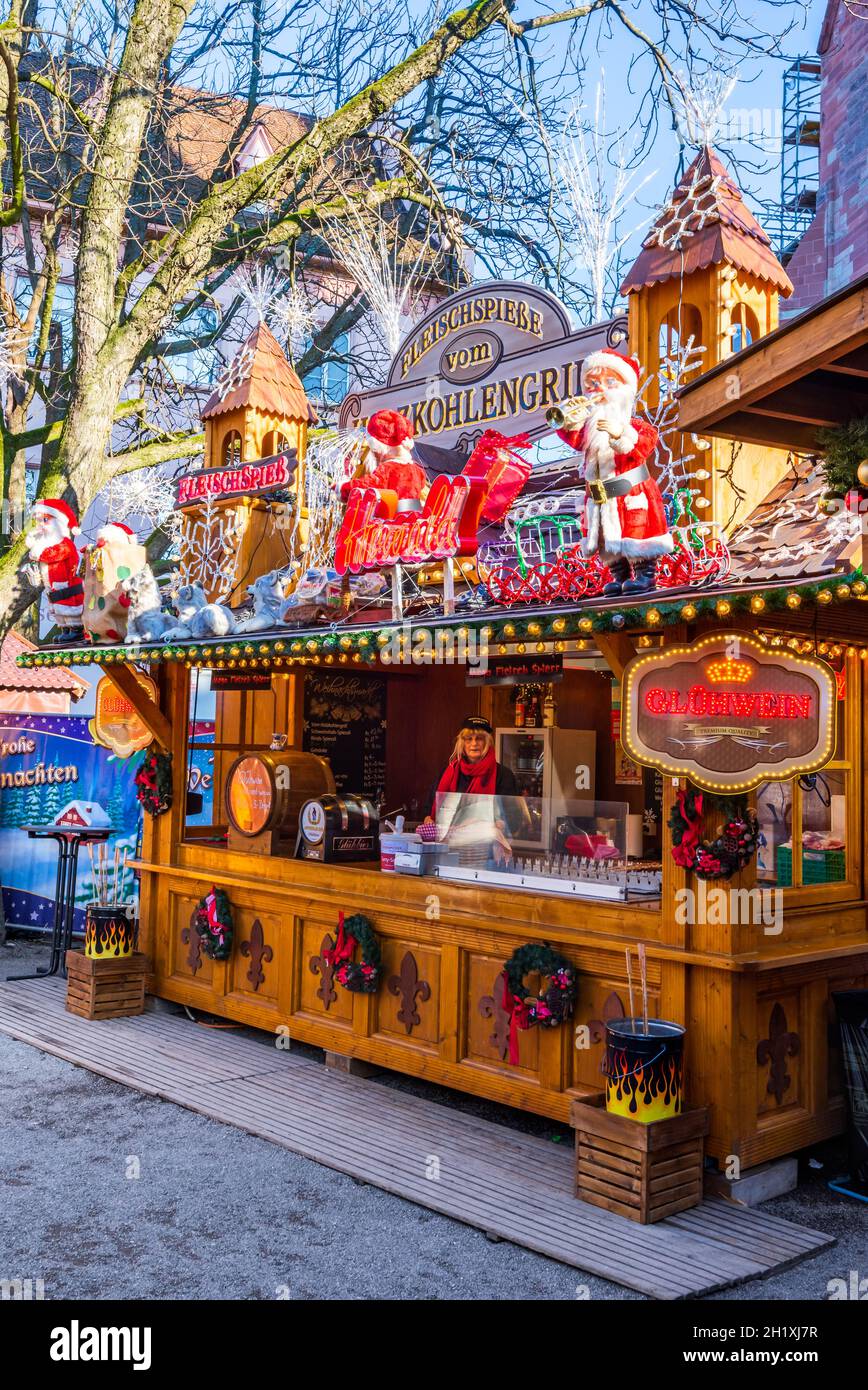 Basel, Switzerland - December 2017. GlueBasler Weihnachts Markt and mulled wine wooden house in Munsterplatz. Stock Photo