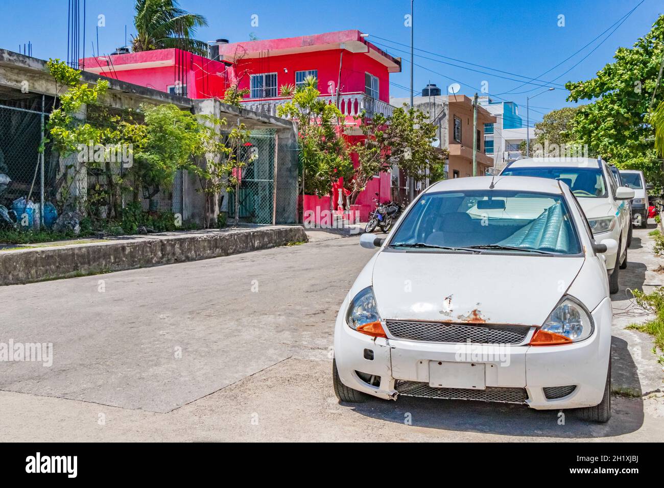 Typical street road and cityscape with cars and building of Playa del