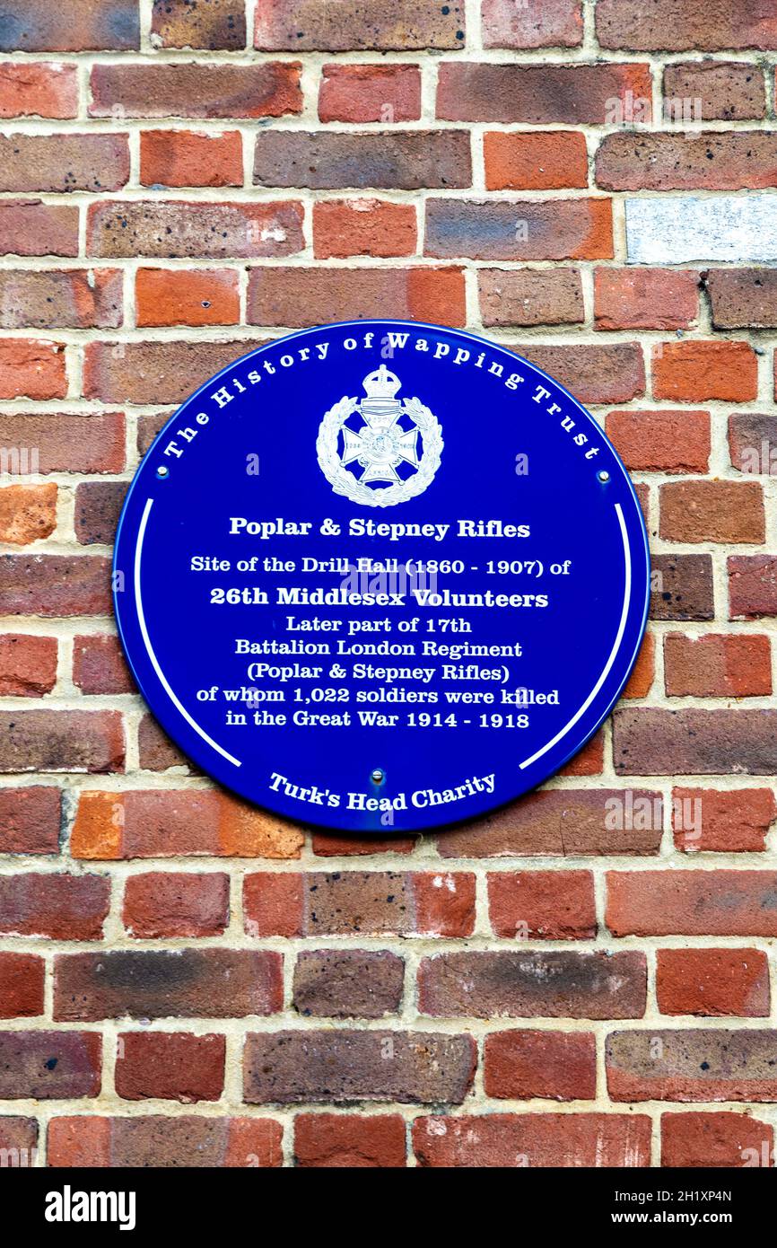 Poplar and Stepney Rifles memorial blue plaque in Wapping Wall, Shadwell Basin, London, UK Stock Photo