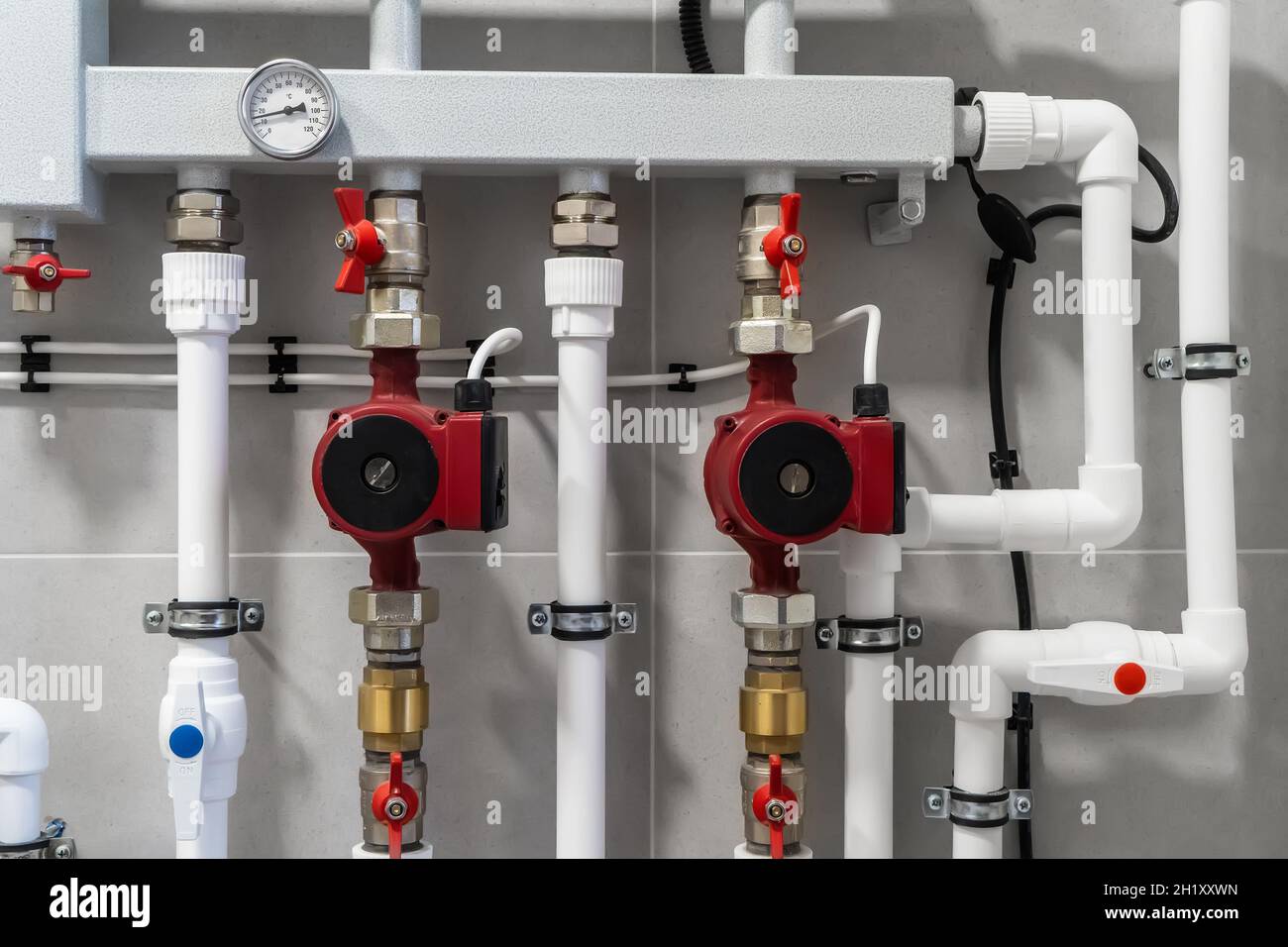 House heating system with modern plastic pipes, manometers and tubes