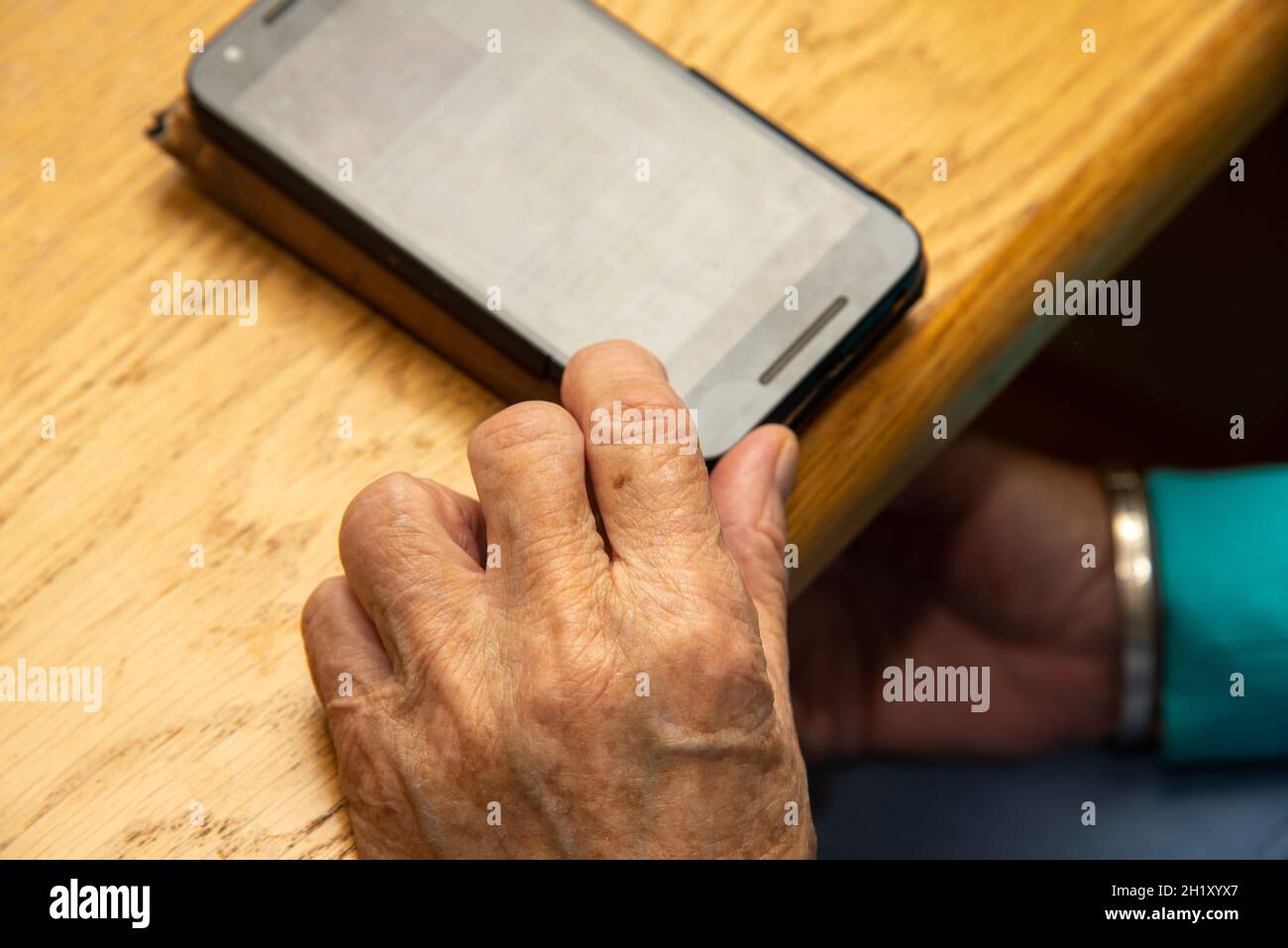 hands with mobile phone and whatsapp of aged woman Stock Photo