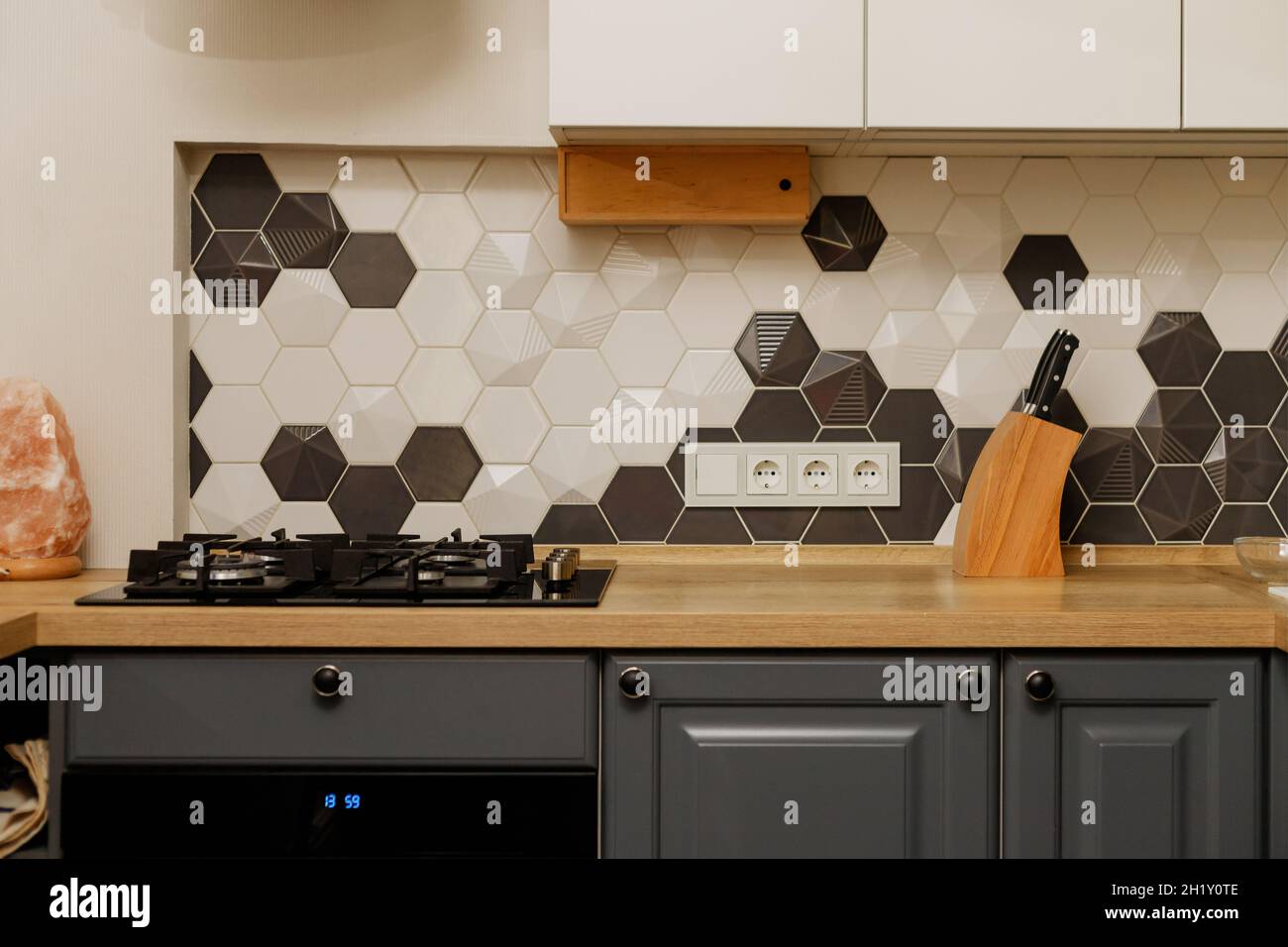 Modern kitchen interior with hood with white and gray mixed