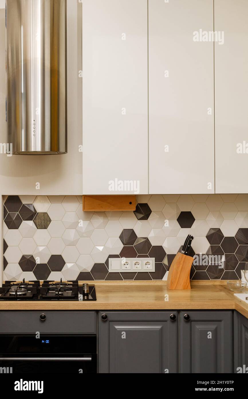Modern kitchen interior with hood with white and gray mixed