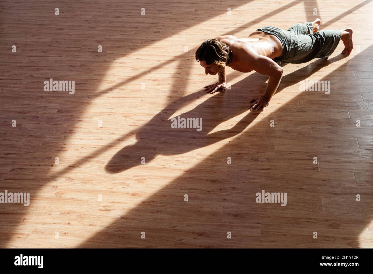 Man doing push ups at the gym Stock Photo