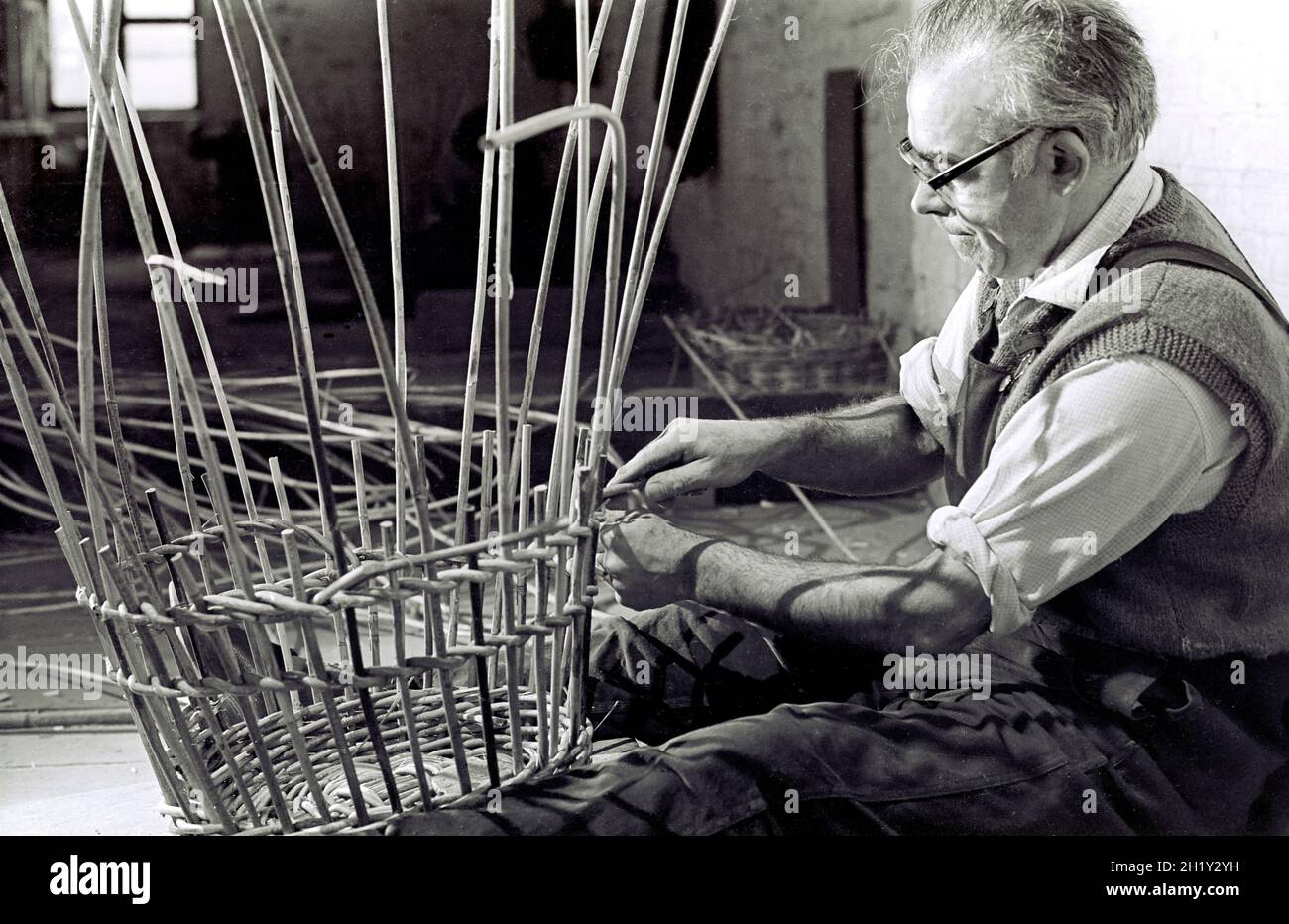 Fish basket maker making a basket in a Grimsby factory in the 1960's Stock Photo