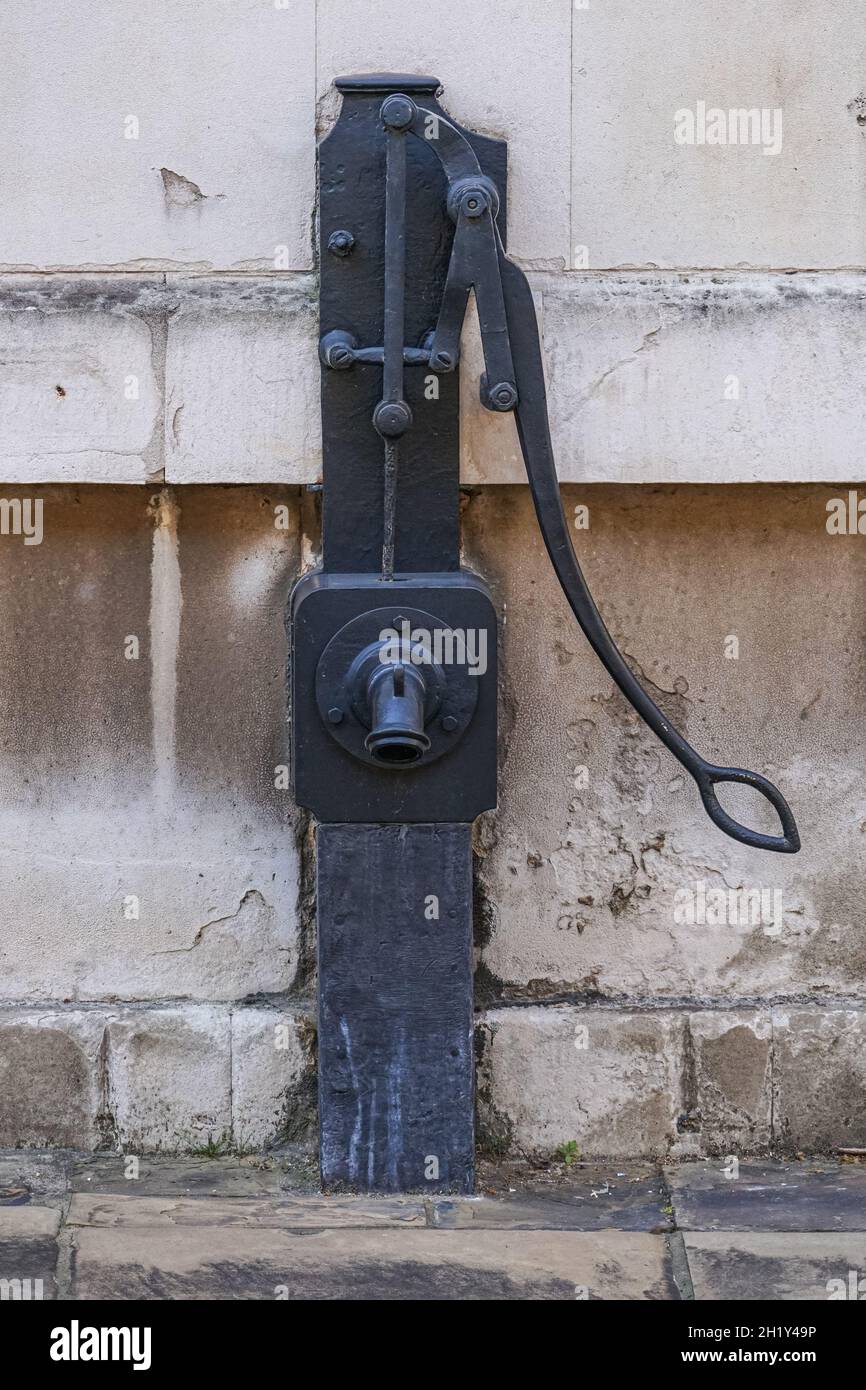Old cast iron hand water pump in London, England, United Kingdom, UK Stock Photo