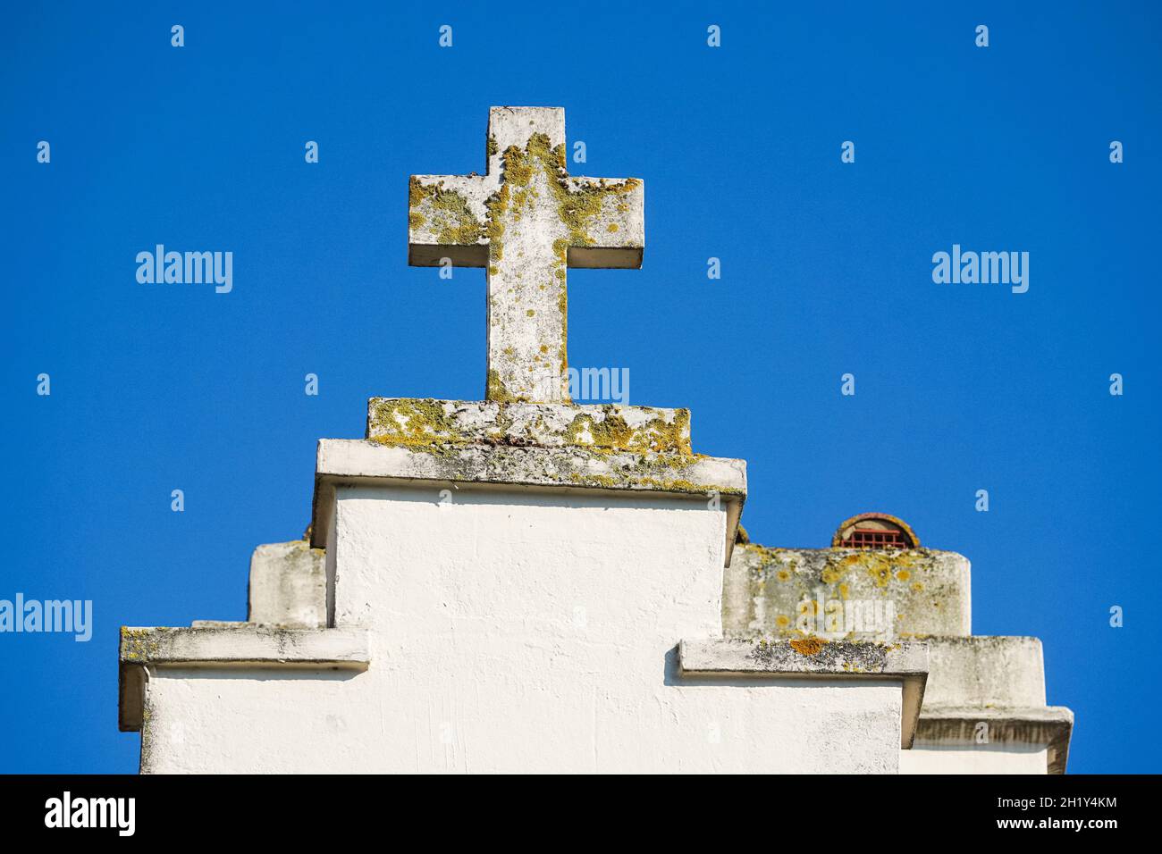 Cross on top of old church in London, England United Kingdom UK Stock Photo