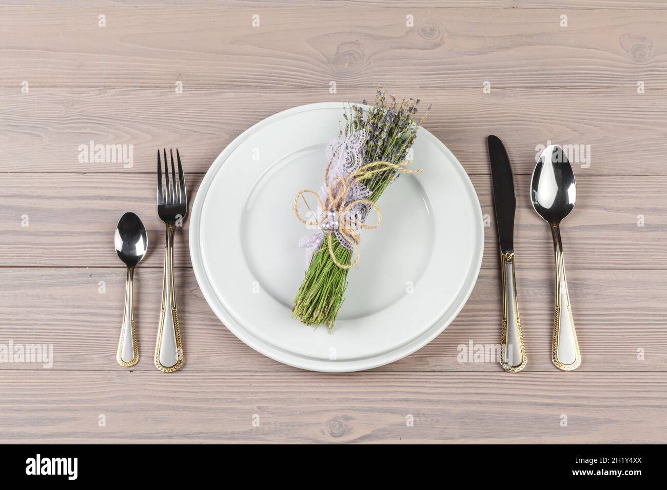 Beautiful rustic table setting on wooden table Stock Photo - Alamy