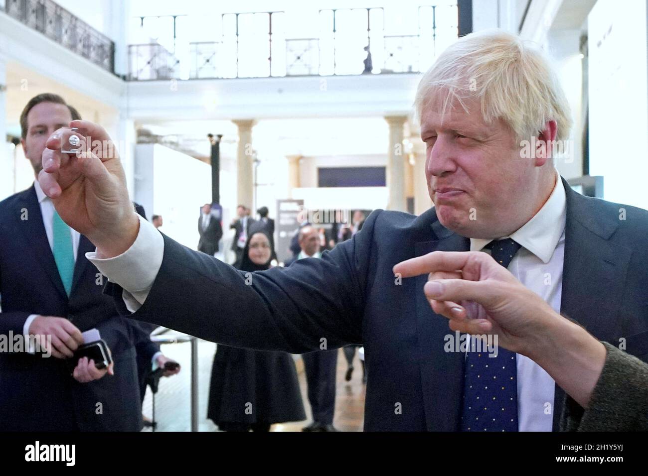 Prime Minister Boris Johnson looks at a product from the First Light Fusion stand during a visit to the Innovation Zone of the Global Investment Summit at the Science Museum, London. Picture date: Tuesday October 19, 2021. Stock Photo