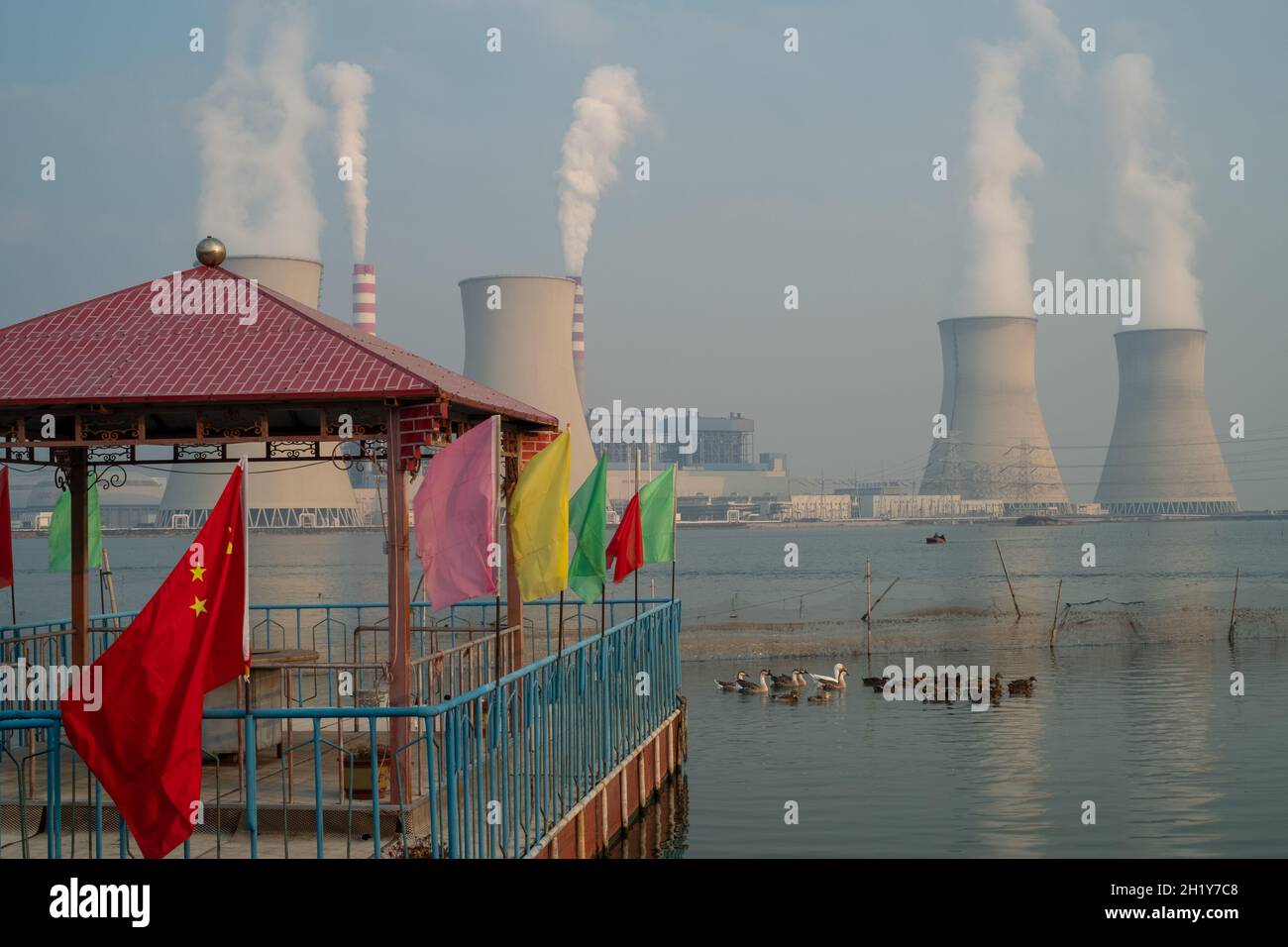 China flag decorating a pavilion is seen in front of a power plant in Tianjin, China. 19-Oct-2021 Stock Photo