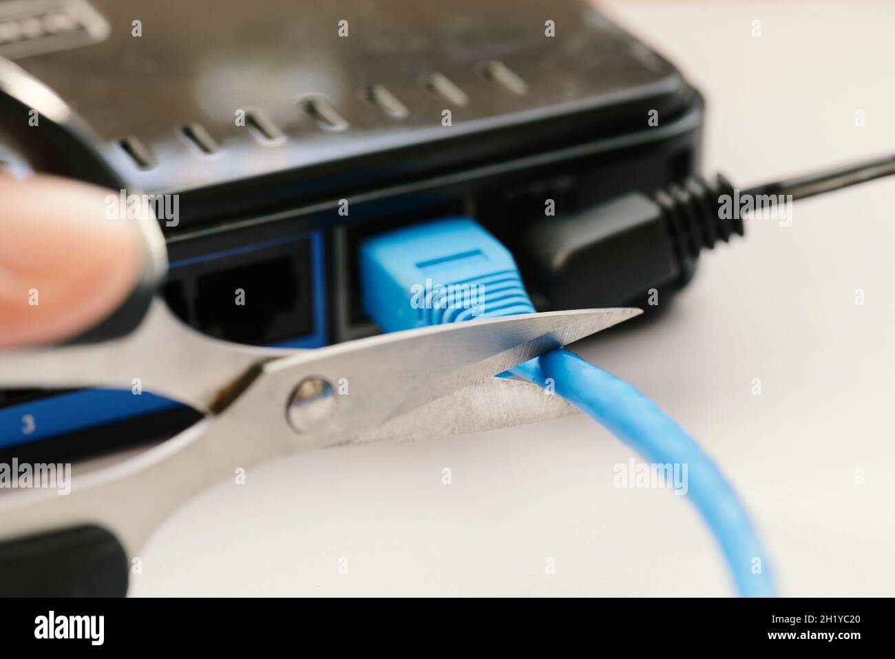 Scissors cutting LAN cable no more Stock Photo Alamy