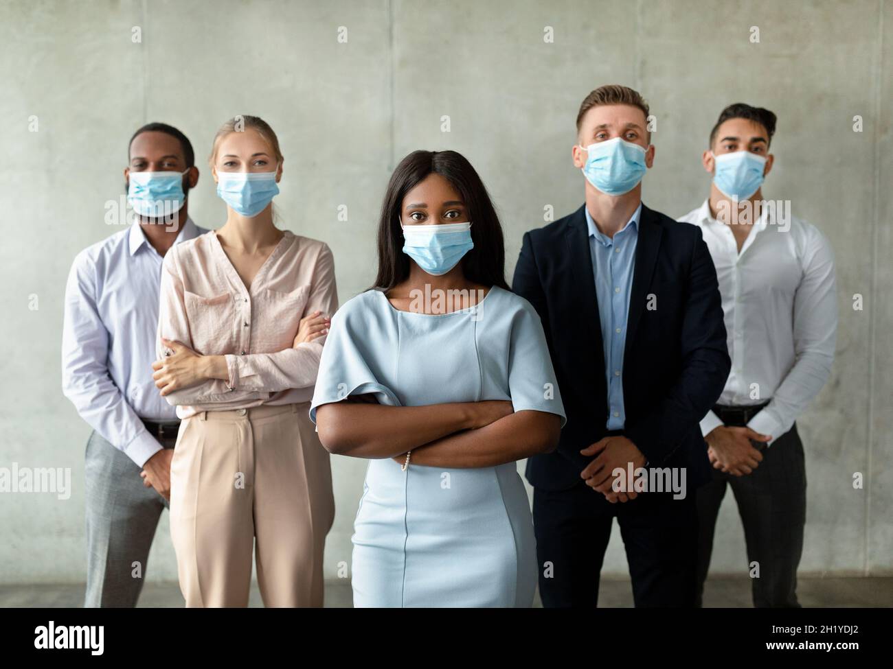 Return To Work Concept. Multiethnic Business Team Wearing Face Masks ...