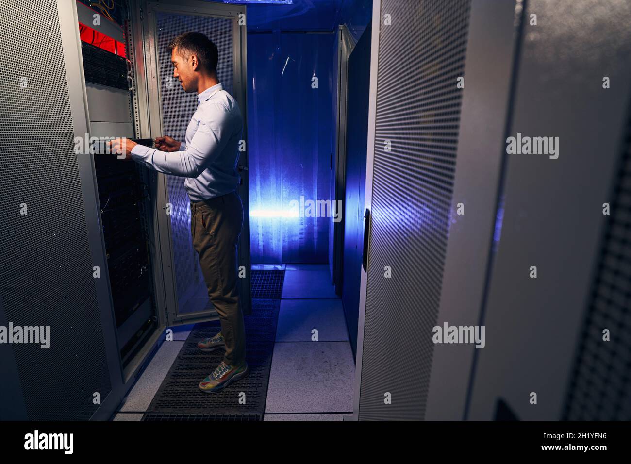 Expert Caucasian system administrator doing hardware refresh Stock Photo