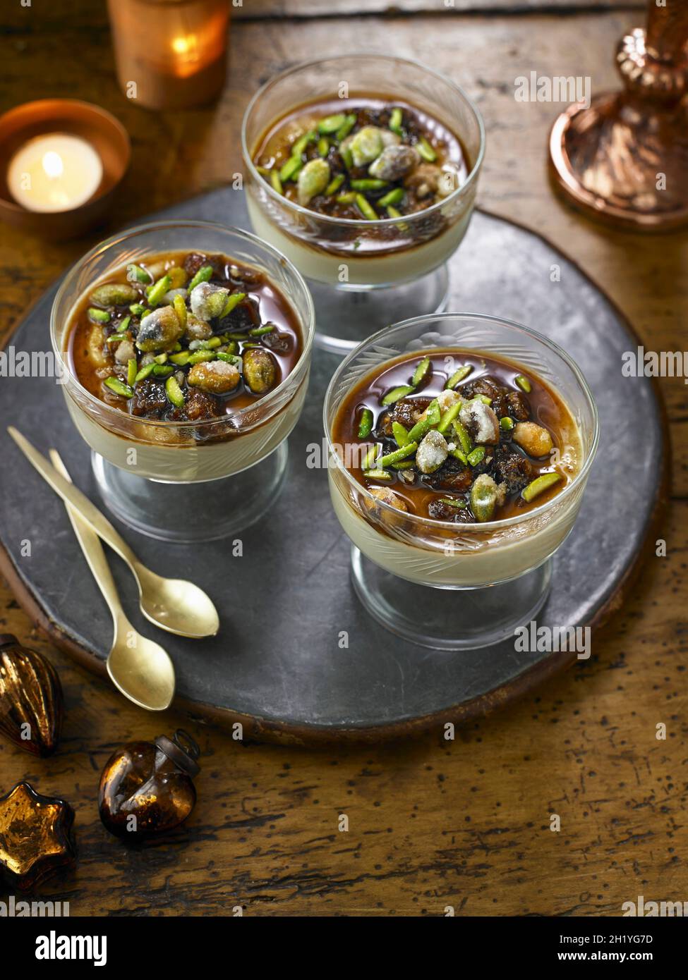 Banana custard with christmas dates and pistachios dessert Stock Photo