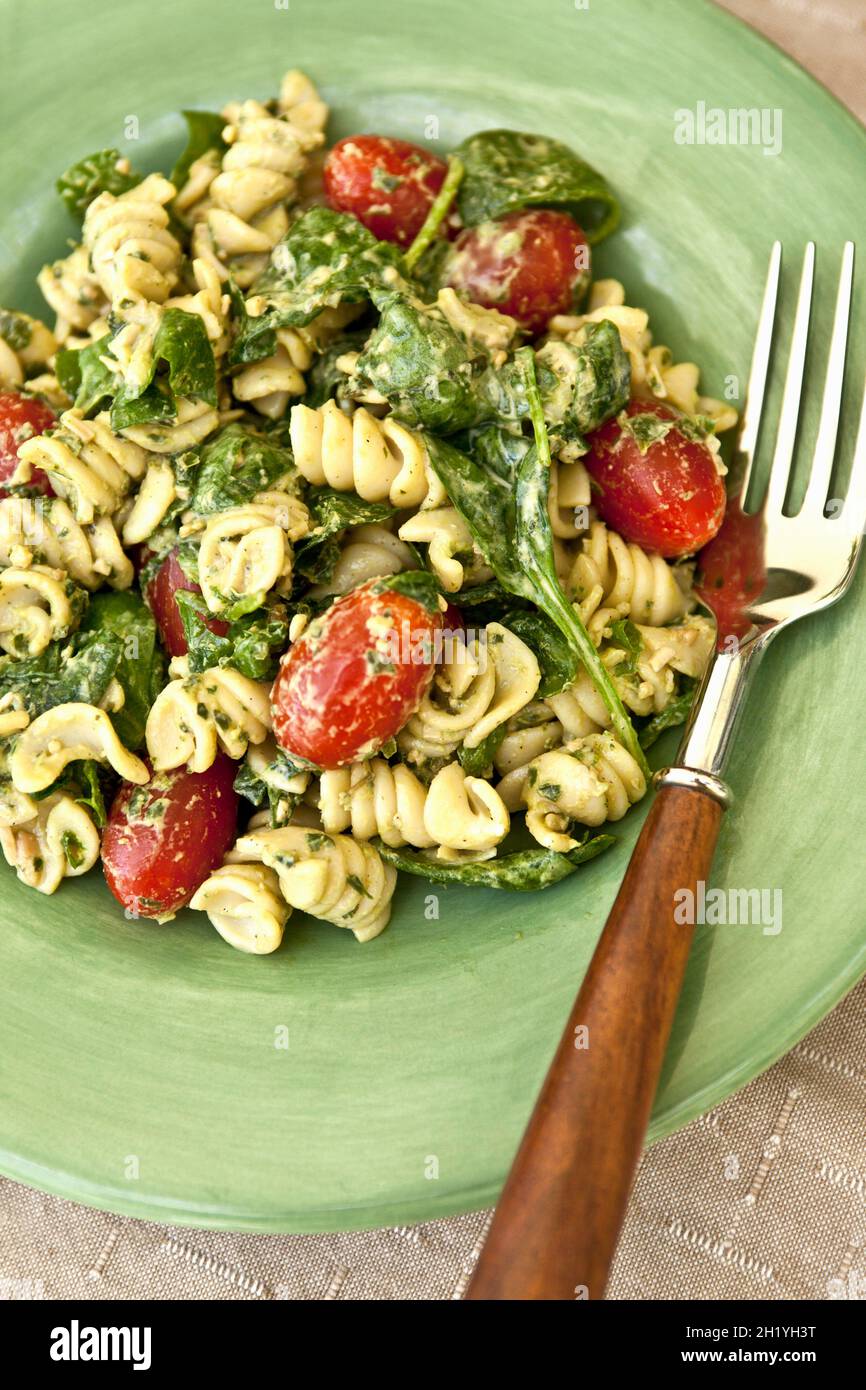 Pasta salad with basil pesto and tomatoes Stock Photo Alamy
