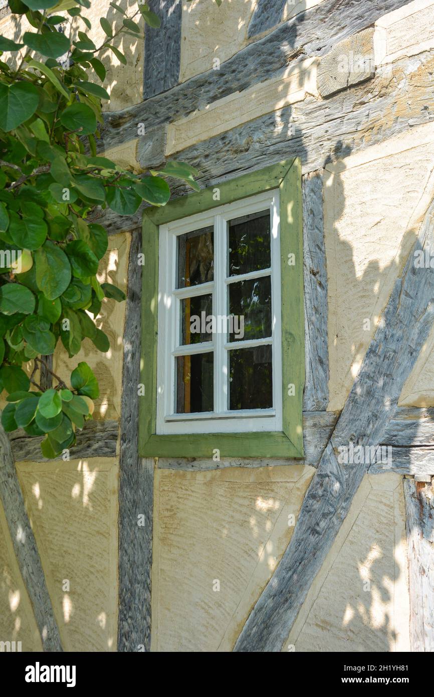 Old window from bygone times on a half-timbered house Stock Photo