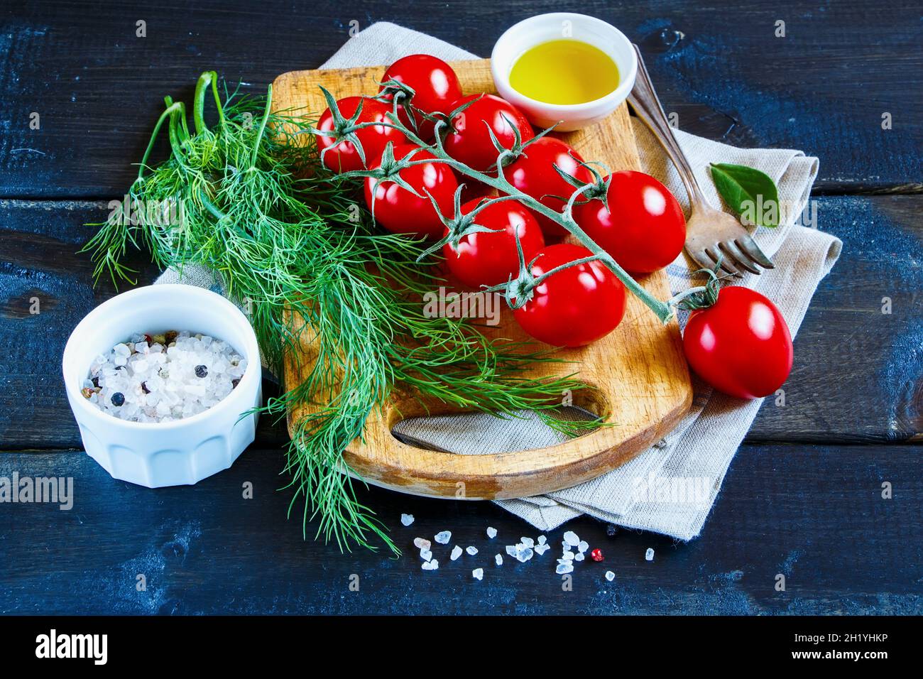 Still life with tomatoes, dill, spices and oil Stock Photo - Alamy