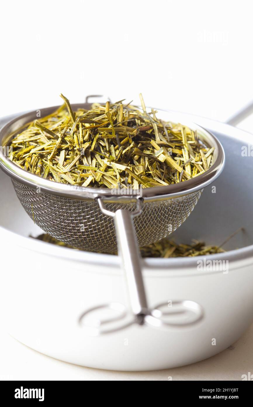 Japanese Kukicha tea in a strainer and a bowl Stock Photo Alamy