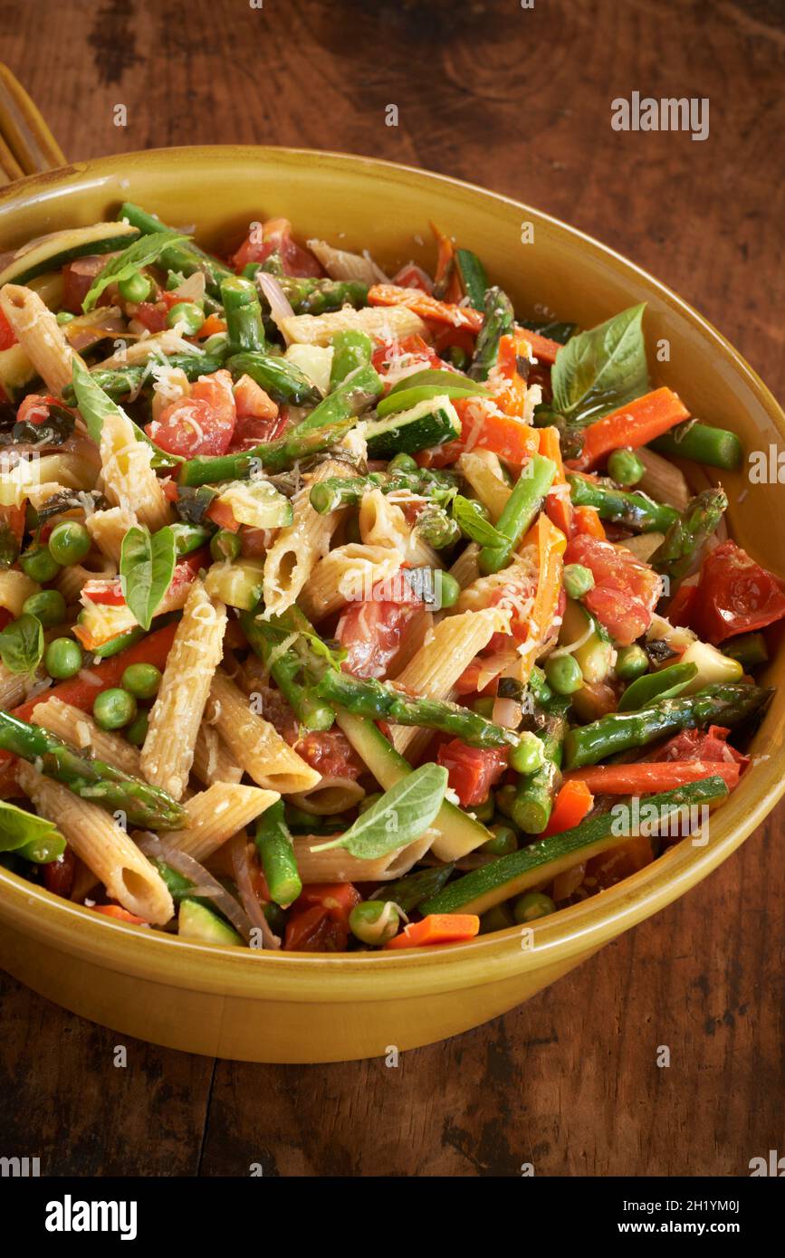 Penne with spring vegetables Stock Photo - Alamy