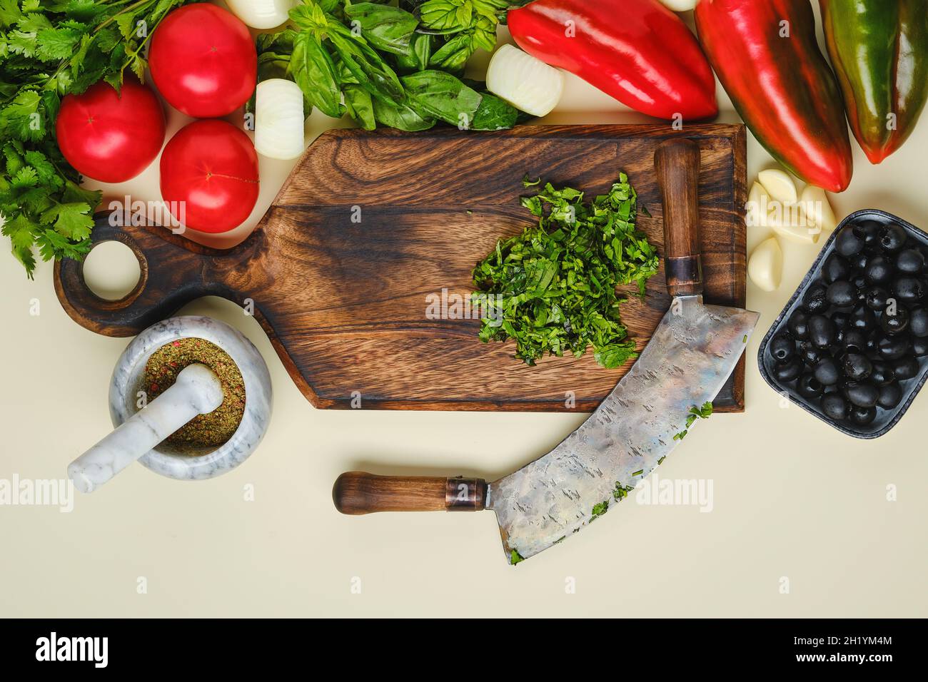 Top view of mezzaluna and ffresh vegetables Stock Photo