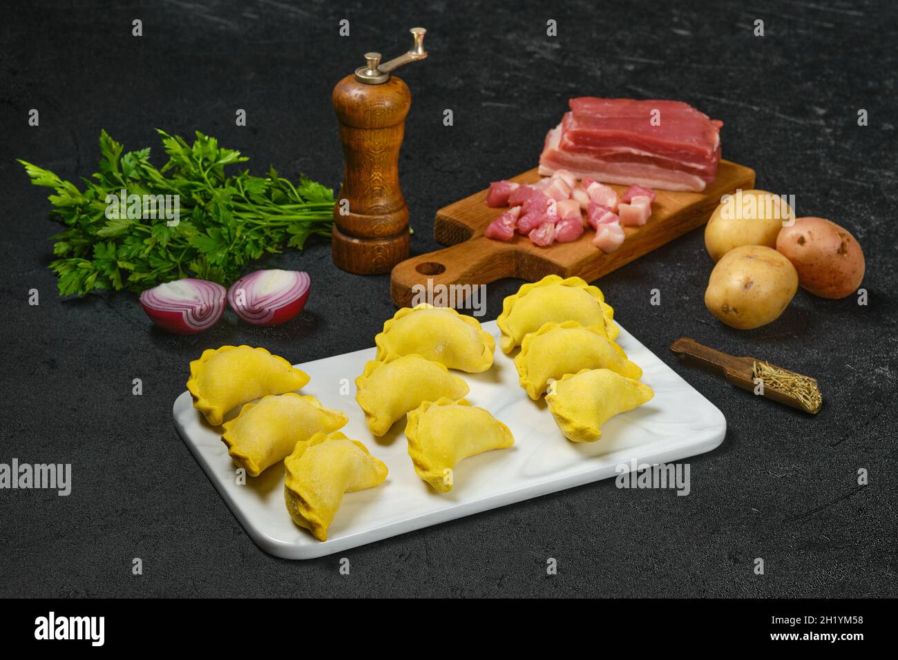 Frozen dumplings with bacon and potato Stock Photo Alamy