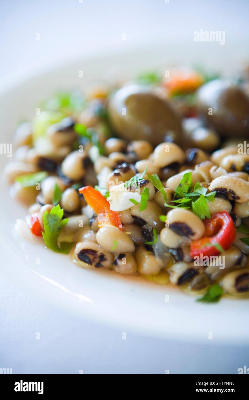 White bean salad with peppers and parsley Stock Photo
