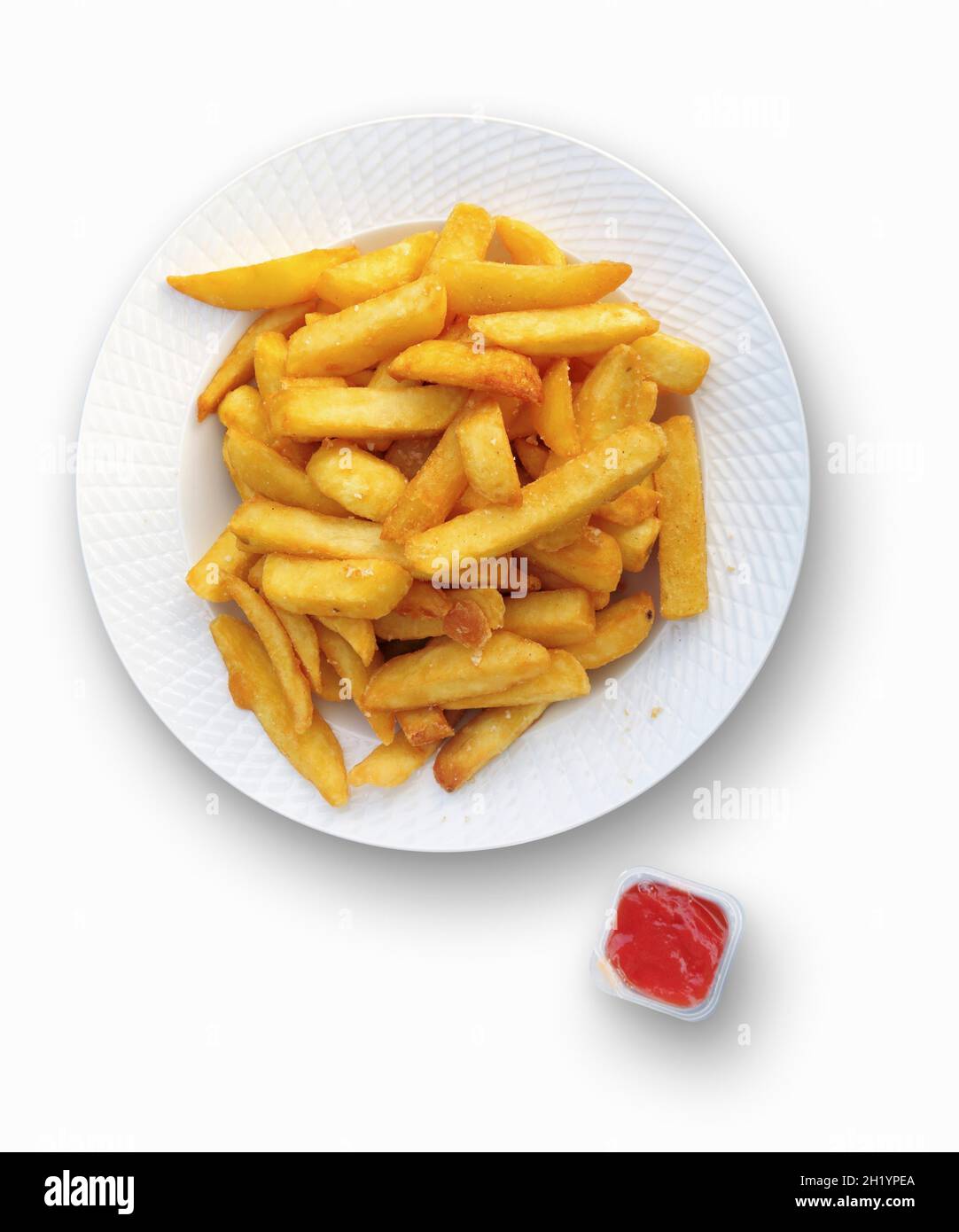 Ketchup on French fries, close-up, elevated view Stock Photo