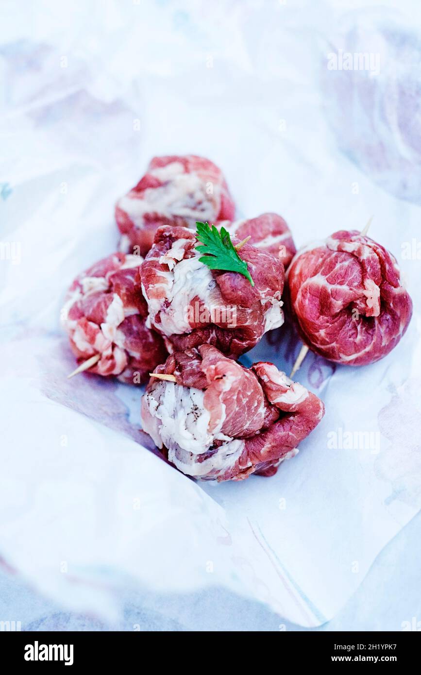 Raw 'La Bombetta Pugliese' (marbled pork shoulder filled with cheese, Italy  Stock Photo - Alamy