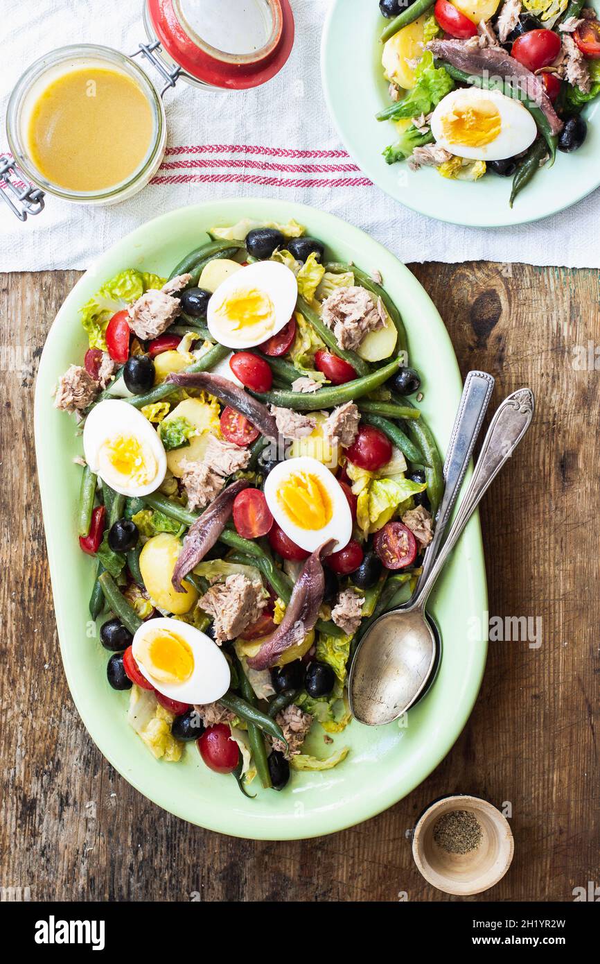 Salad nicoise with romain lettuce, cherry tomatoes, tuna, green beans