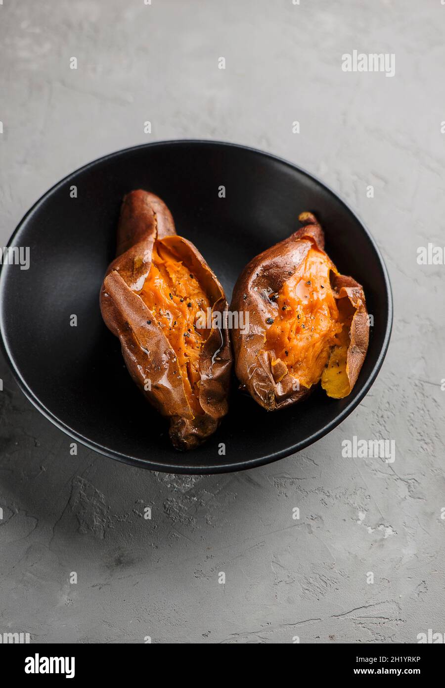 Oven baked sweet potato Stock Photo - Alamy