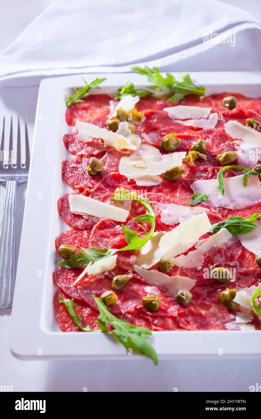 Carpaccio (slices of raw beef with capers and Parmesan cheese, Italy) Stock Photo
