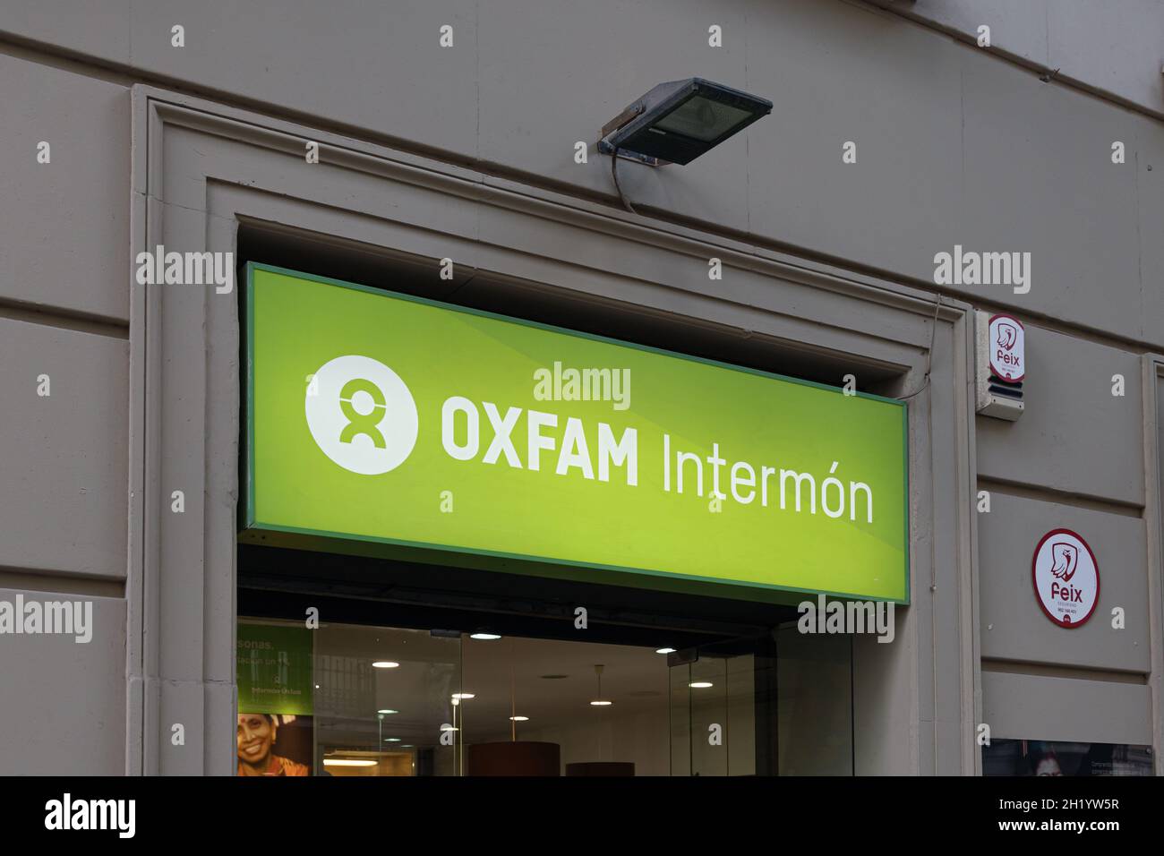 VALENCIA, SPAIN - OCTOBER 14, 2021: Oxfam is a confederation of 20 independent charitable organizations focusing on the alleviation of global poverty Stock Photo